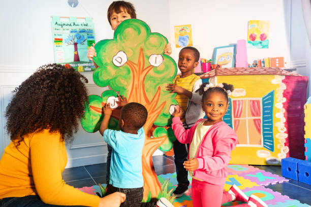 istock Alphabet tree game kids put letters of their name 1209856711