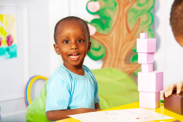 istock Little boy building blocks in nursery school 1209856716