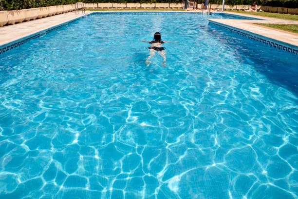 person swimming in the pool. Holiday concept, sport
