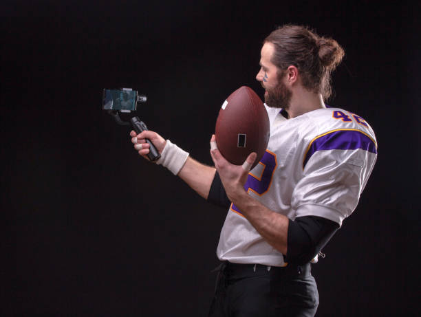 istock Footballer with smartfone on gimbal 1209858905