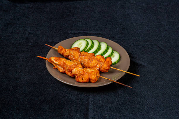 istock Kebab, sliced cucumber on a light plate 1209859875