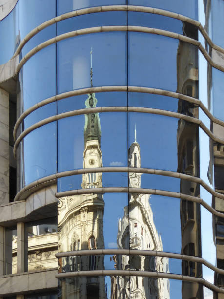 istock Buildings reflected in glass building 1209859882