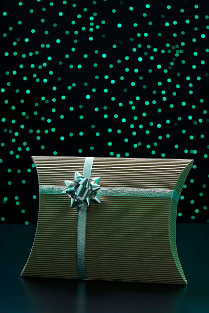 istock Elegant gift box with ribbon against green illumination background 120986632