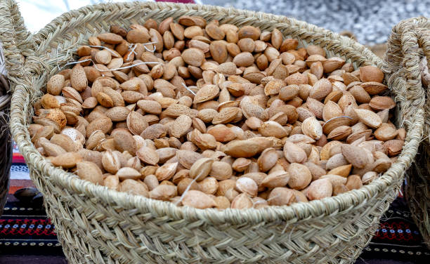 istock Autumn almonds in basket. Background with autumn almonds. Selective focus. Closeup. 1209866606
