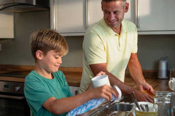istock Washing Dishes with Father 1209867279