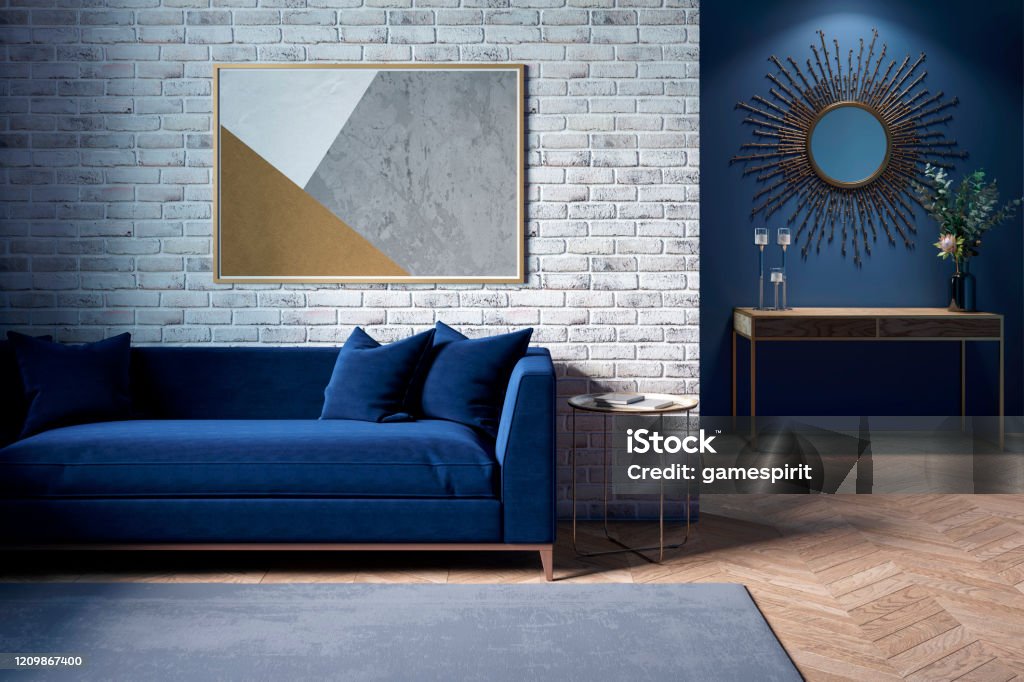 The Interior Of A Modern Living Room With A Dark Blue Sofa Next To A Brick  Wall On Which A Horizontal Poster Hangs In The Background You Can See A  Mirror Above