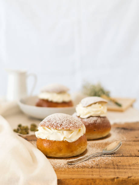 istock Traditional Swedish dessert Semla with whipped cream and sugar 1209867496