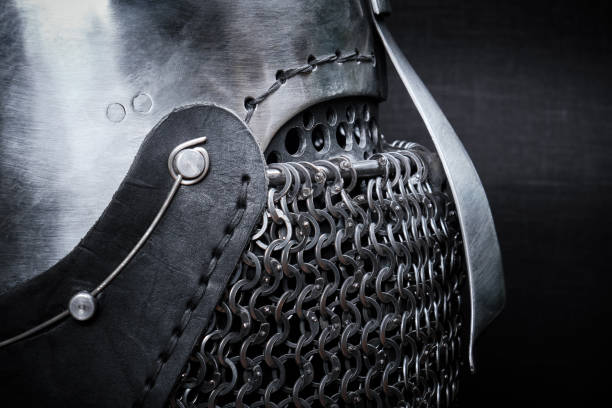 istock Knight's helmet close-up side view on a black. 1209872201