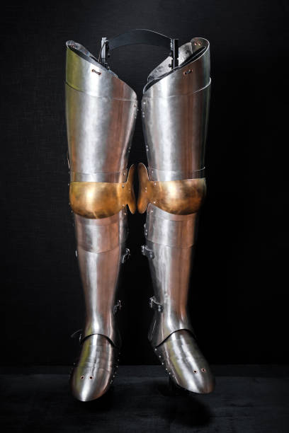 istock Real knight armor for legs on a black. 1209872466