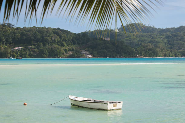 istock little Boat in Seychelles Lagoon 1209873563