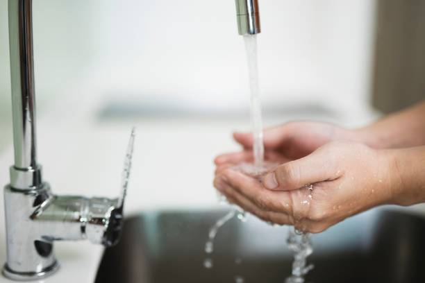 istock image of  washing hands with water. 1209873656