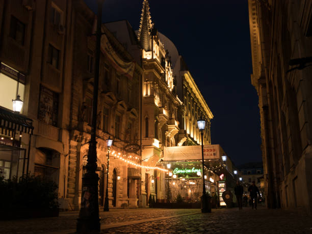 Bucharest, Romania - February 17, 2020: Caru'cu bere Cafe is lit by night-light in central Bucharest, Romania.