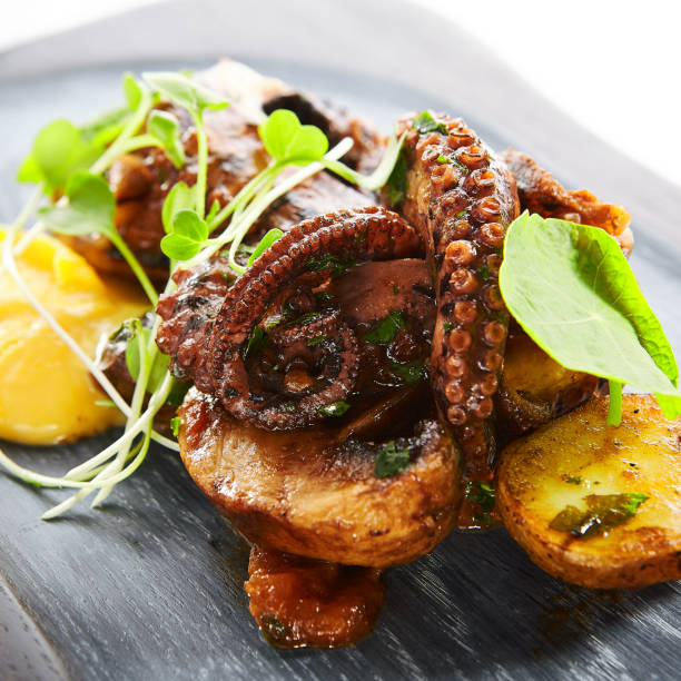 istock Grilled octopus with baked potatoes 1209876970