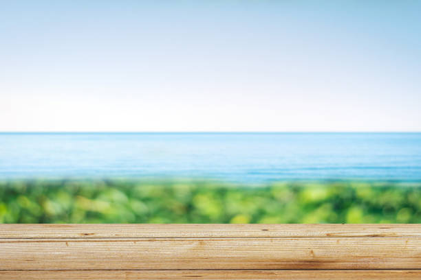 istock Wooden table on the beach 1209877034