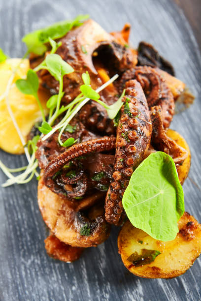 istock Grilled octopus with baked potatoes 1209877281