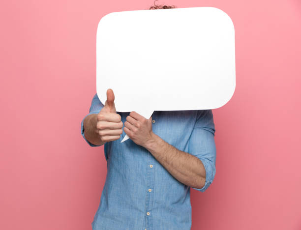 istock young casual guy covering face with speech bubble 1209877287