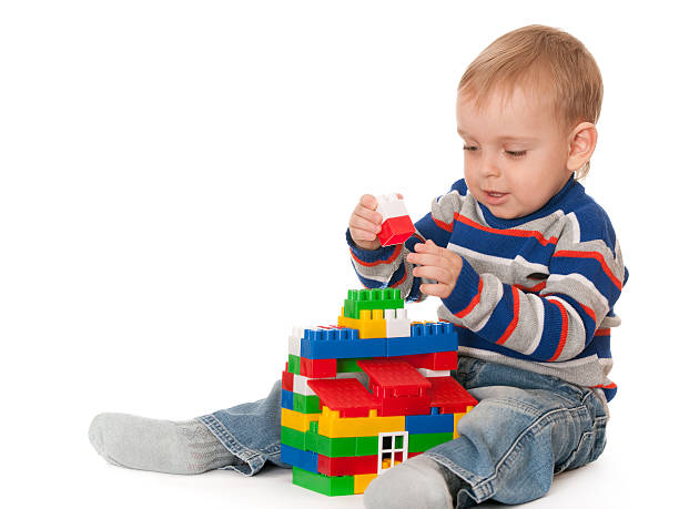 istock Kid building a toy house 120987795