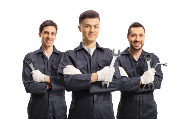 istock Group of male workers in uniforms with tools 1209878282