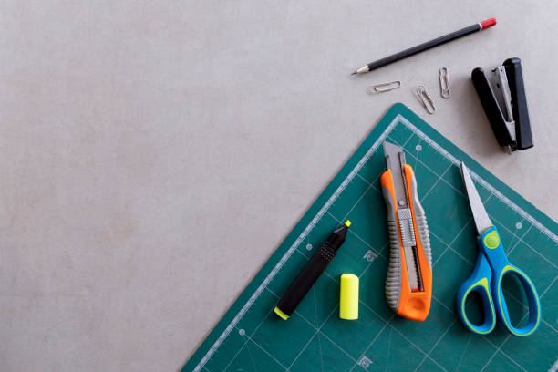 istock stationary and office equipment on cement table background. top view 1209878725
