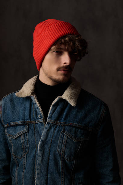 istock serious guy in denim jacket looking to side and posing 1209879665