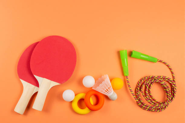 istock Sport equipment on orange background. 1209881359