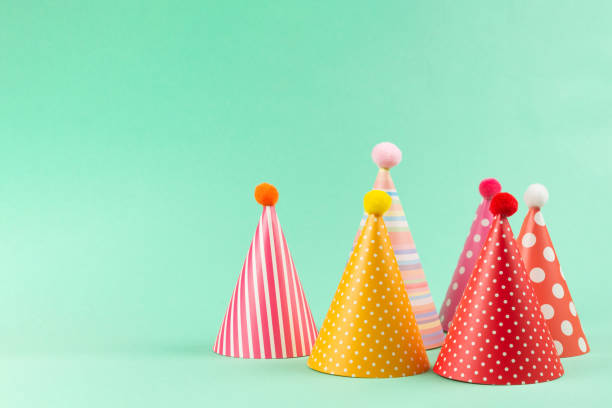 istock Colorful birthday caps on mint background. 1209881383