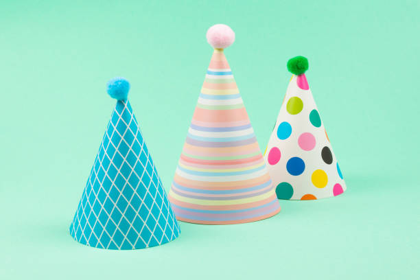 istock Colorful birthday caps on mint background. 1209881385