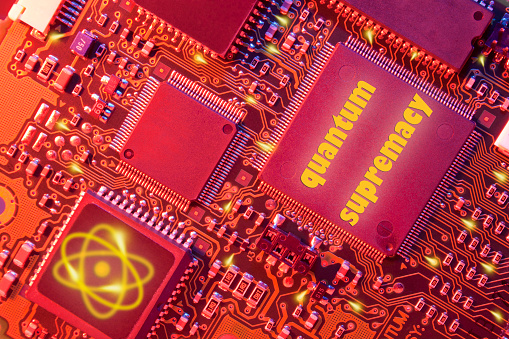 Tilted electronic board close up illuminated in orange light. Concept of quantum supremacy.