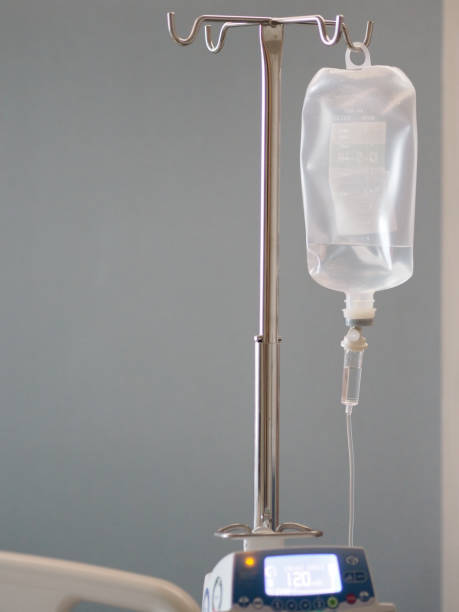 Patient's saline feeding equipment, Fluid filled Set IV solution drip in the ward hospital, salt water Patient's saline feeding equipment, Fluid filled Set IV solution drip in the ward hospital, salt water saline drip stock pictures, royalty-free photos & images
