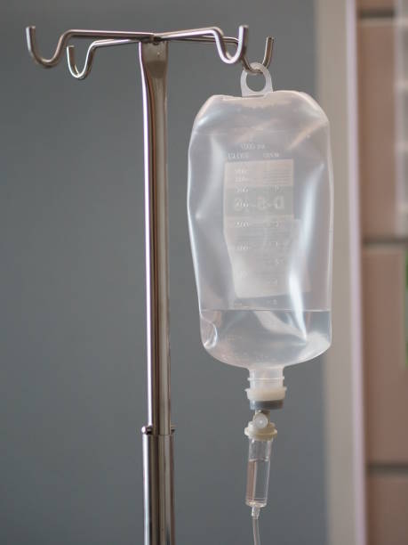 Patient's saline feeding equipment, Fluid filled Set IV solution drip in the ward hospital, salt water Patient's saline feeding equipment, Fluid filled Set IV solution drip in the ward hospital, salt water saline drip stock pictures, royalty-free photos & images