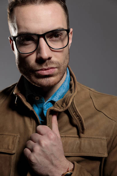istock Confident fashion model adjusting his jacket 1209882052