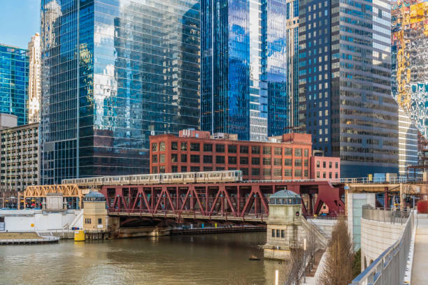 istock Chicago River walk with train running over the rail track, illinois, USA 1209882101