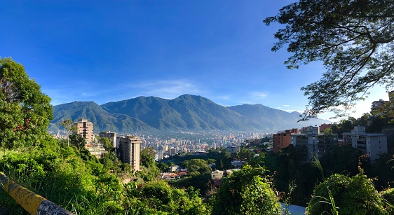 Cityscape of Caracas, Venezuela, with Avila mountain in the background in a Sunny beautiful day.