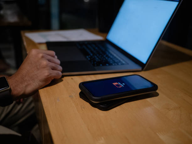 istock Mobile wireless charge sharing to charge mobile phone 1209883949