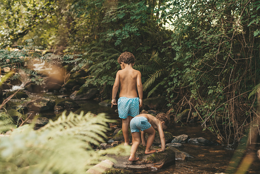 Boys playing in the river