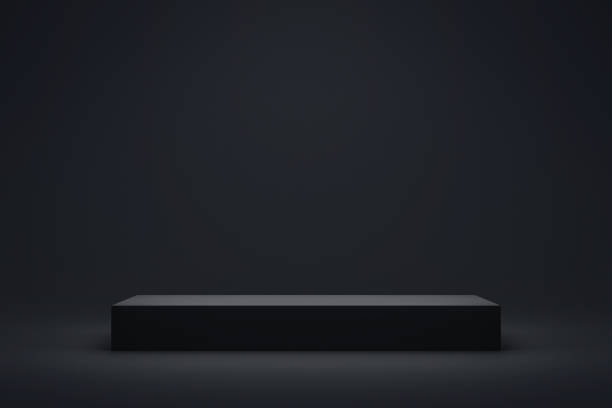 Black podium or pedestal display on dark background with long platform. Blank product shelf standing backdrop. 3D rendering.