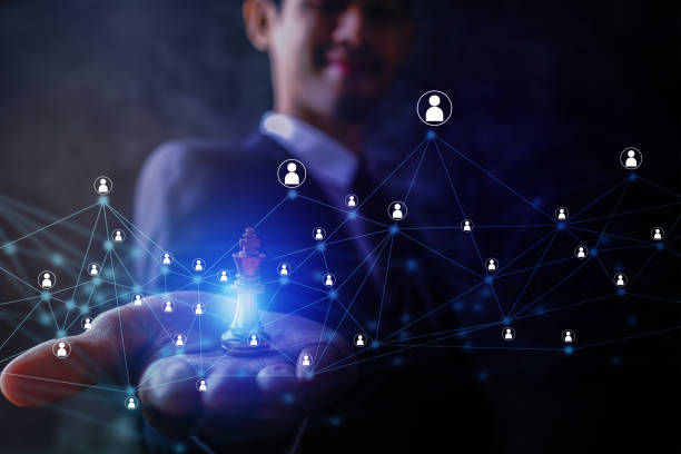 leader strategy and intelligence connection line concept, businessman holding king chess on palm with connection of global social data with people icon