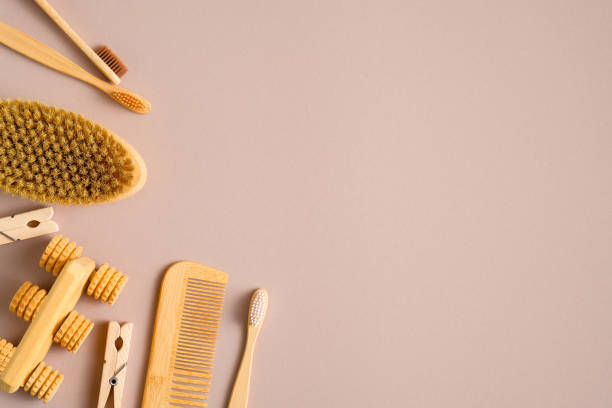 istock Eco friendly wooden bathroom tools on brown background. Flat lay natural bath massage brush, bamboo toothbrushes, hair comb, pins. Zero waste, plastic free concept. Sustainable lifestyle. 1209886465