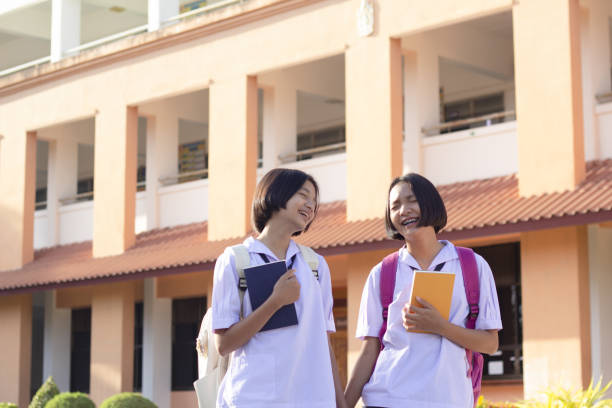 istock Happy young Asian girl at School with uniform. 1209886468