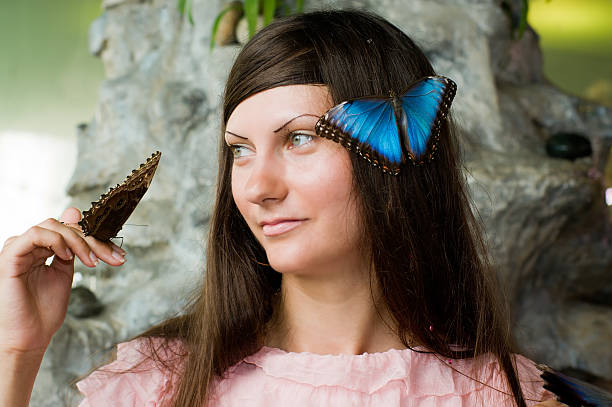 istock Beautiful young woman with a butterfly 120988861