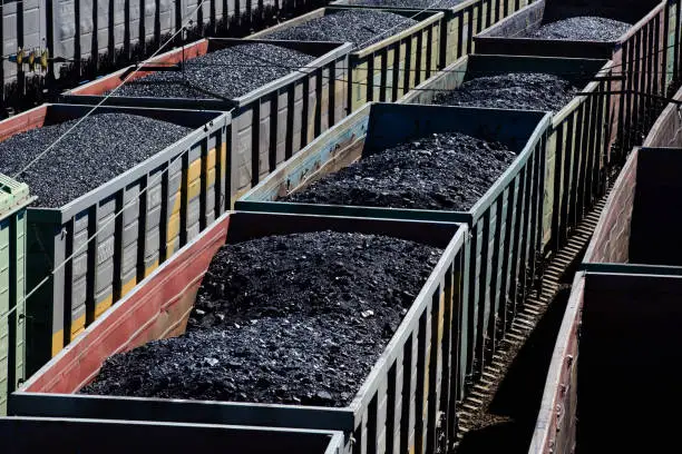 Photo of Fraight green wagons full of coal.