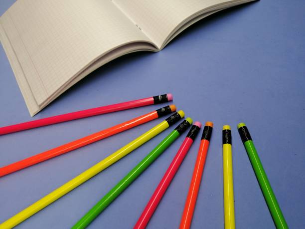 istock colored pencils with an open page of a notebook 1209891533