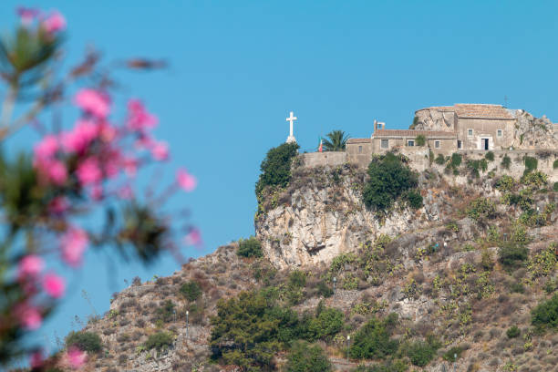  Beach in Scilla, a town located in the province of Reggio Calabria in Southern Italy. View on the rock with Ruffo Castle and the beach front ( Marina Grande).The Ruffo castle is dividing Scilla  in two parts: the  old part ( Rione Chianalea) and the new part ( Marina Grande).