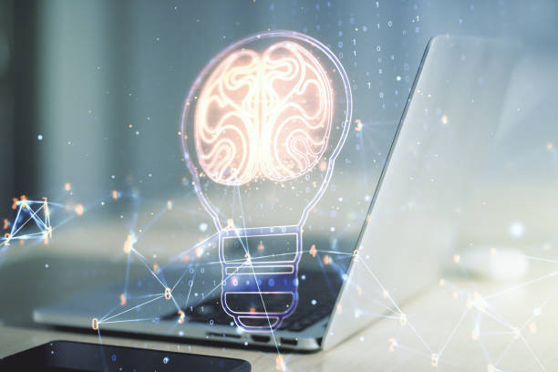 istock Creative light bulb with human brain hologram on modern laptop background, artificial Intelligence and neural networks concept. Multiexposure 1209893436