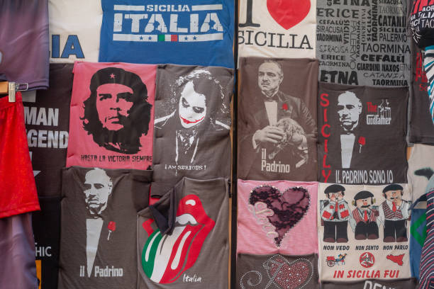 T shirts for sale in Taormina, including of The Godfather (mafia) and Che Guevera