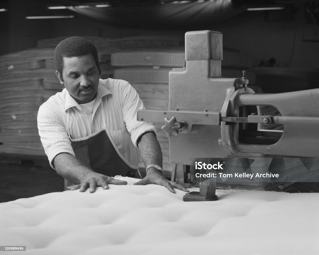 Man manufacturing duvet in factory  Black And White Stock Photo