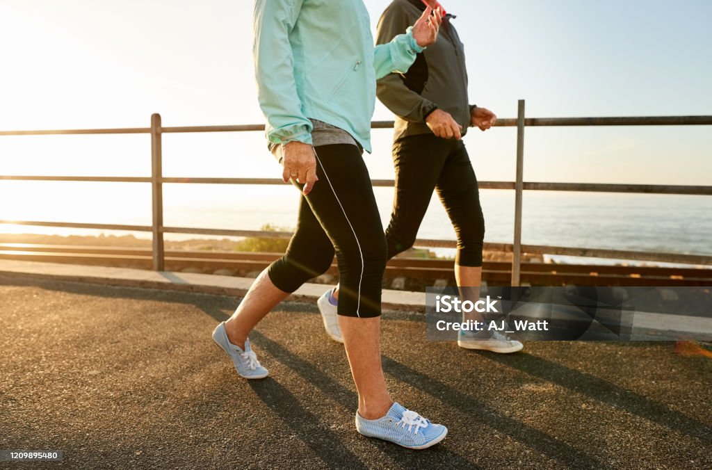 Walking keeps you healthy Cropped shot of two senior women walking together in morning Walking Stock Photo