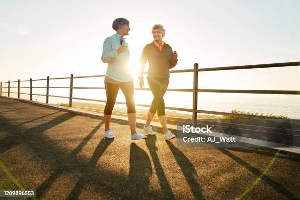 Morning Walk Is A Blessing For The Whole Day Stock Photo - Download Image Now - Walking, Sunrise - Dawn, Senior Adult