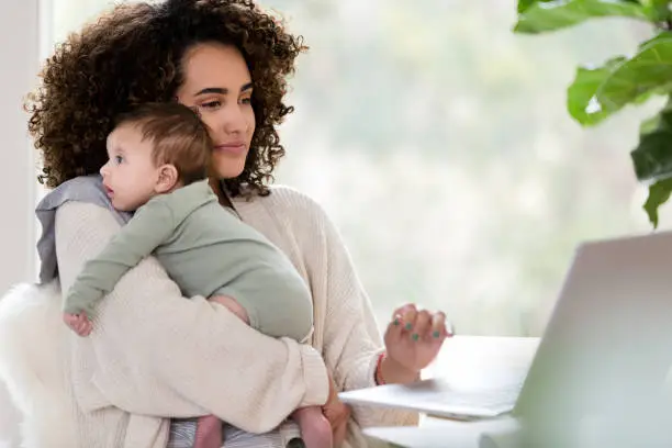 Photo of Multi-tasking mom at work