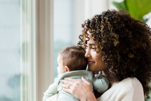 istock New mom enjoys time with her baby at home 1209896644